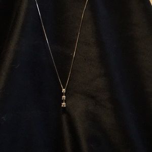 Three stone diamond pendant with chain both 14k